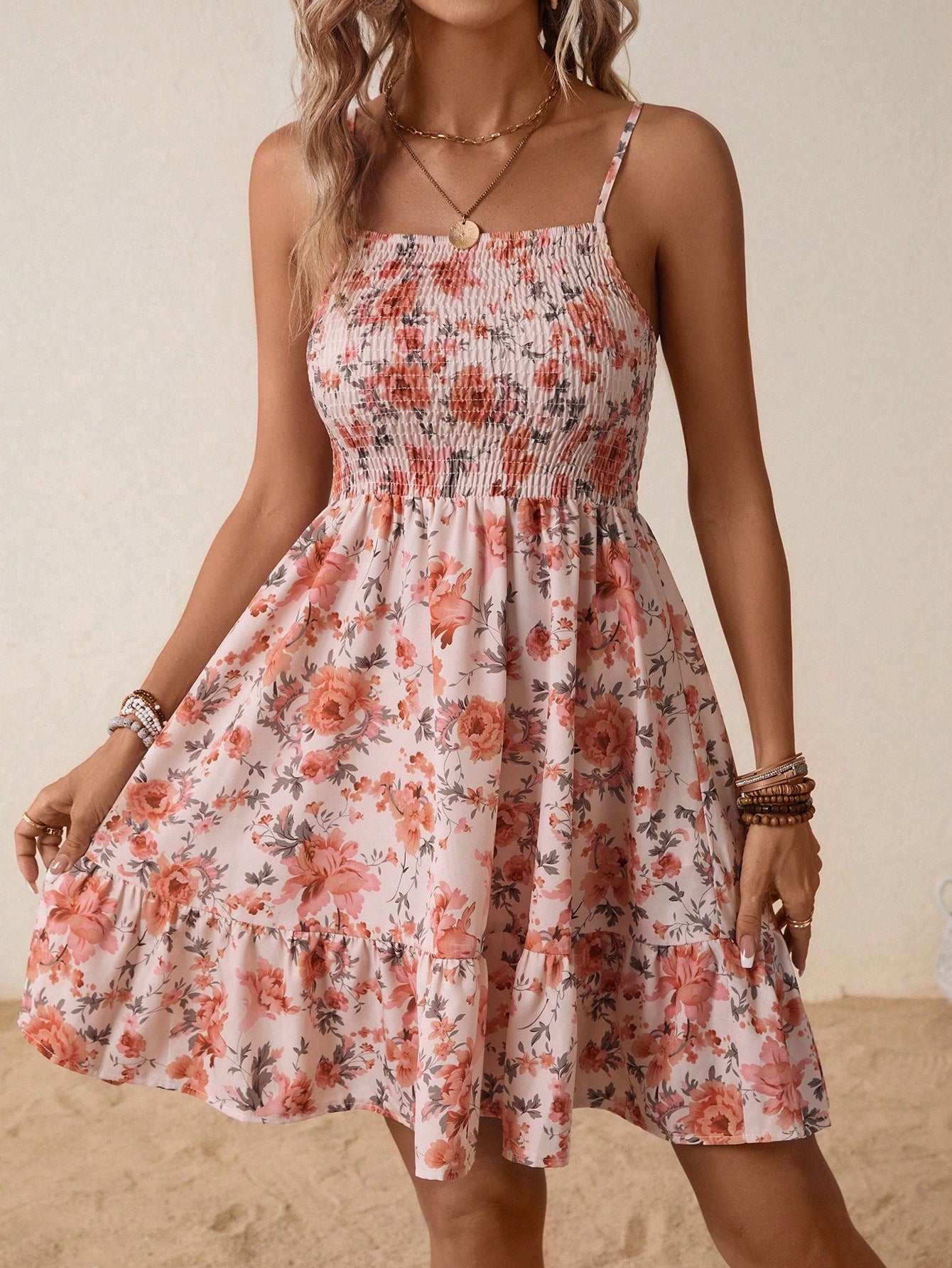 Casual ditsy floral cami dress with shirred bodice and ruffle hem.