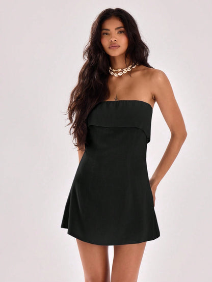 Elegant strapless swing dress with neck seam detail, perfect for spring and summer occasions.