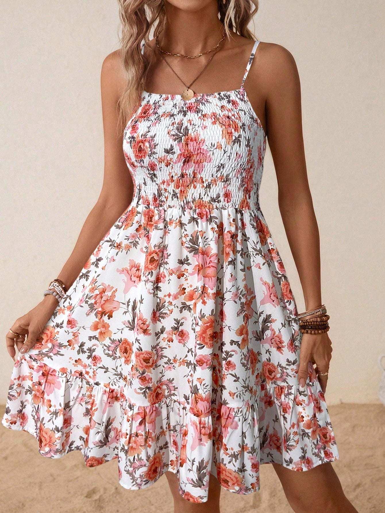 Casual ditsy floral cami dress with shirred bodice and ruffle hem.