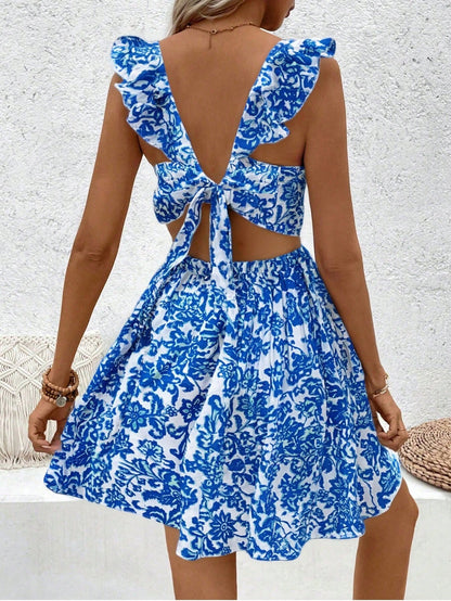 Floral printed dress with hollow-out hem and ruffle trim.