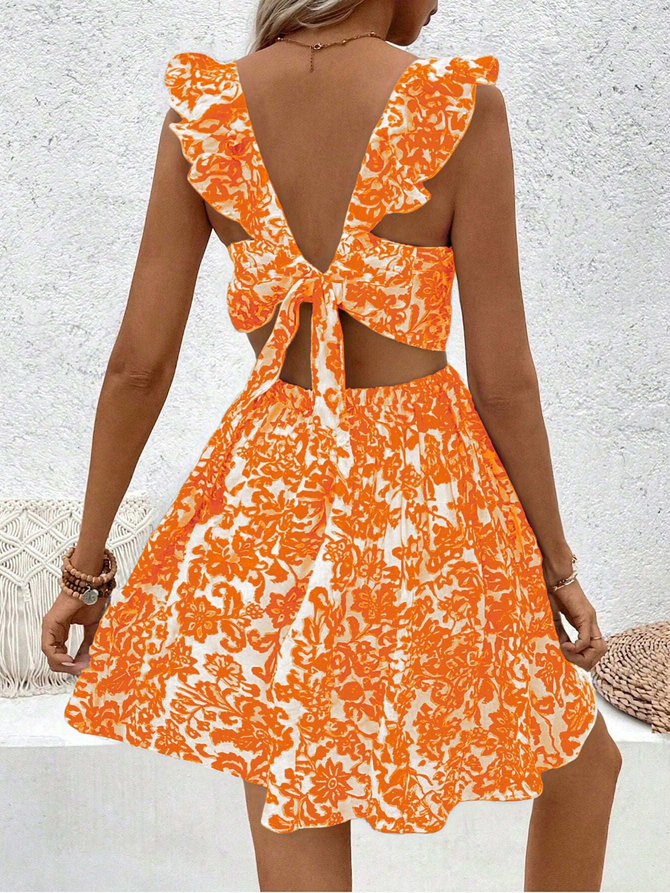 Floral printed dress with hollow-out hem and ruffle trim.