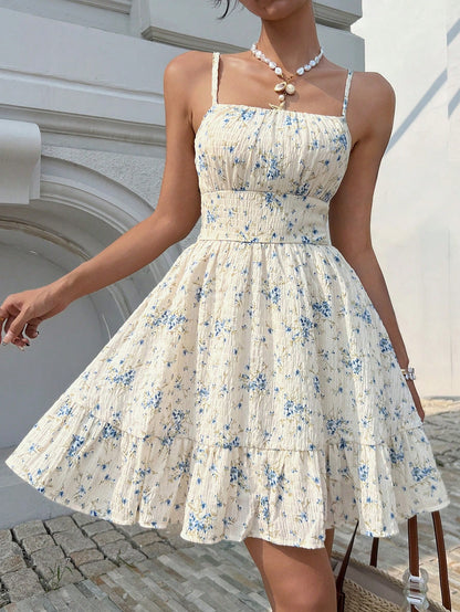 Bohemian ditsy floral spaghetti strap dress with ruffle hem.