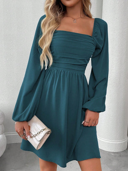 Solid color dress with lantern sleeves and smocked waist.
